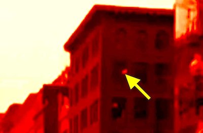 Boston Marathon bomb debris entering window of building revealed by video forensic analysis. Click the above picture to view the video showing how this was uncovered.